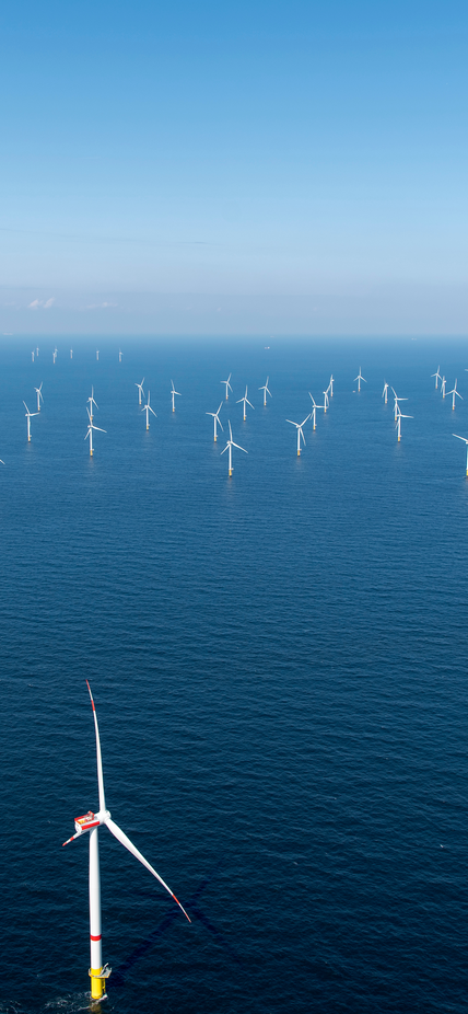 Offshore wind farm in blue water.