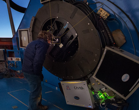 Laird Close, Magellan Adaptive Optics principal investigator, observes Alpha Centauri as the adaptive optics system corrects the image on the 6.5-meter Clay telescope.
