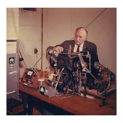 Charles Stacy French working with an instrument at the Department of Plant Biology.